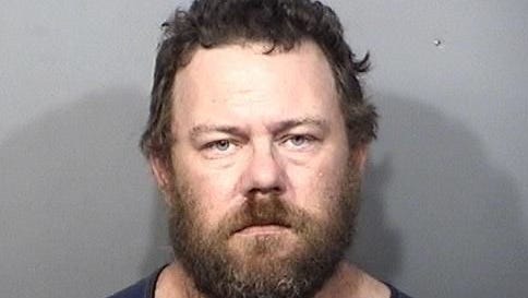 Toby Spencer, 40, of Titusville was arrested Sunday after police say he struck a child in the head with a board or stick with nails in it.