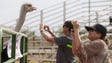 Rita Duncan, of Maricopa, takes a photo of an ostrich