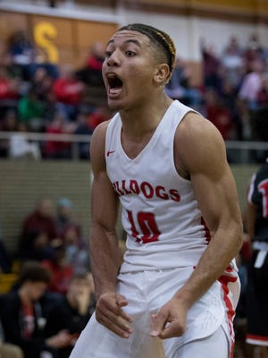 Bosse's Javen Layne (10) celebrates after Jaylin Chinn (1) layup against Harrison during the SIAC Championship game at Central High School Saturday night. Bosse beat Harrison 106-63.