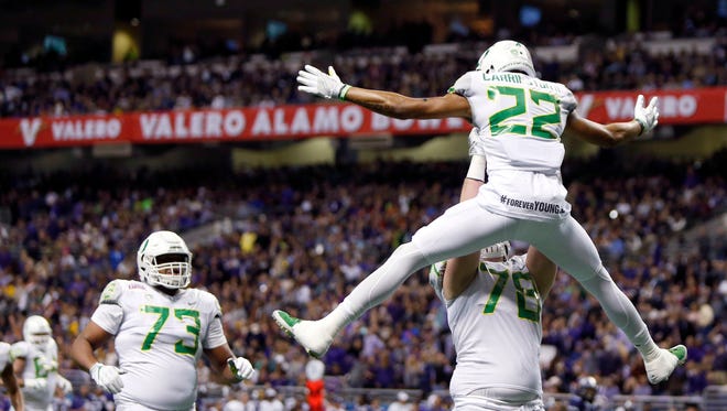 Jan 2, 2016; San Antonio, TX, USA; Oregon Ducks wide receiver Darren Carrington (22) and right guard Cameron Hunt (78) celebrate a touchdown pass reception against the TCU Horned Frogs in the 2016 Alamo Bowl at the Alamodome. Mandatory Credit: Erich Schlegel-USA TODAY Sports