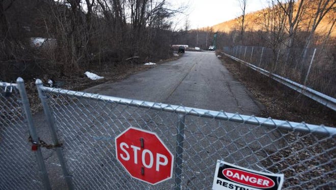 A gate at the end of Peters Mine Road in Ringwood, blocking access to a federal Superfund site.
