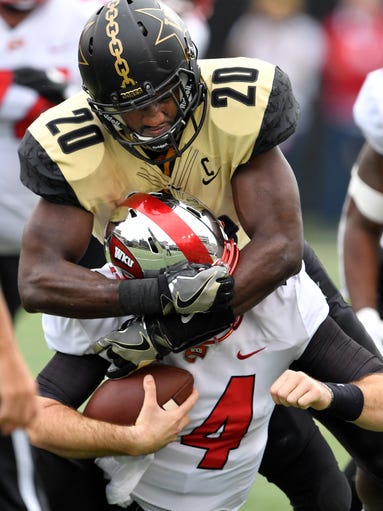 Vanderbilt linebacker Oren Burks (20) tackles Western