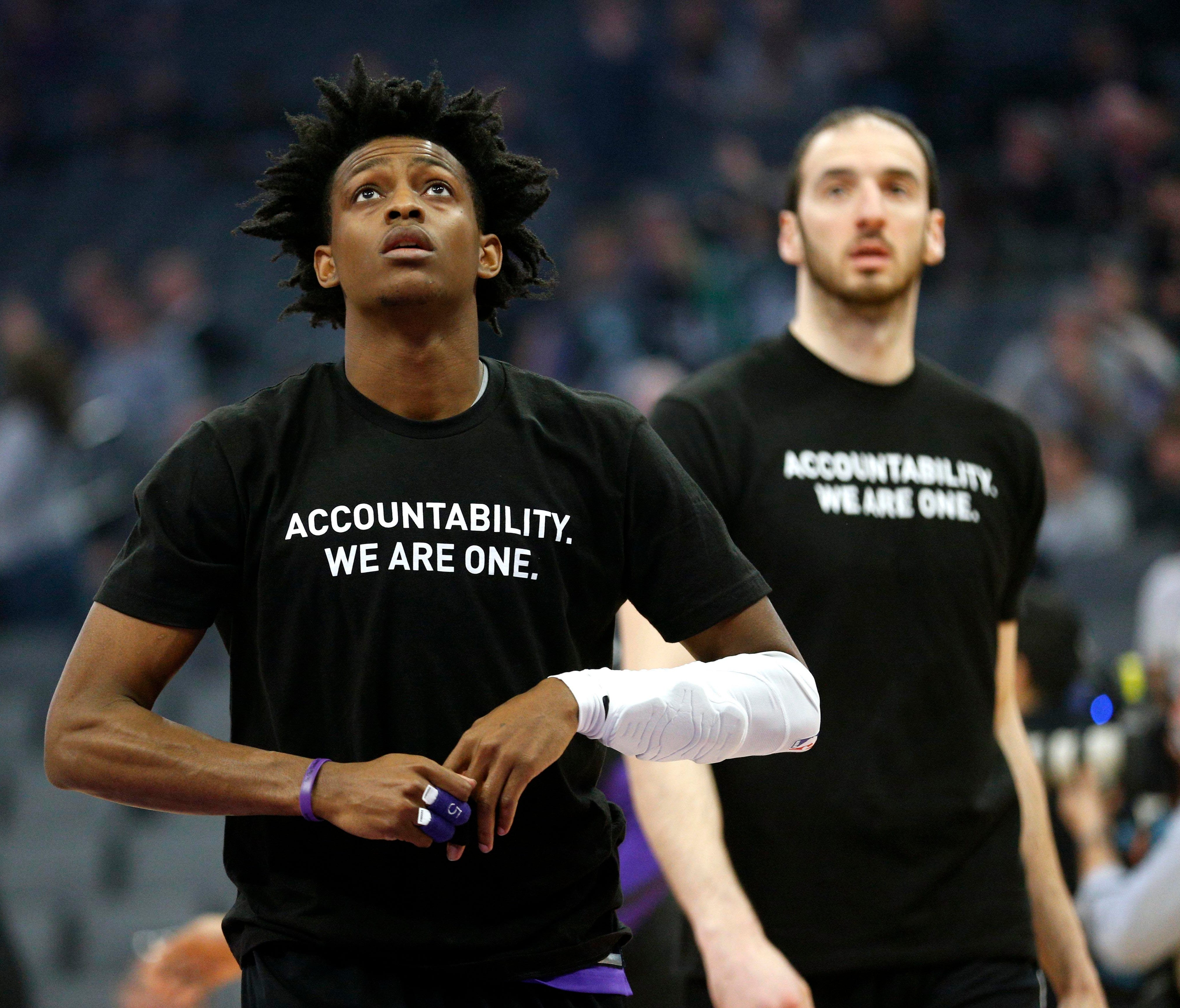Sacramento Kings guard De'Aaron Fox stands on the court before the start of the game against the Boston Celtics.
