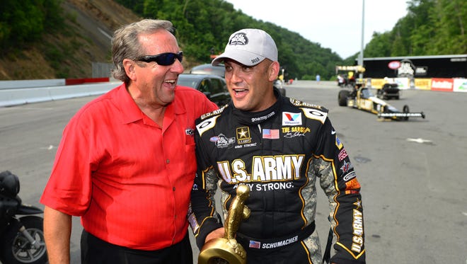 Don Schumacher celebrates with his son Tony Schumacher in 2012. Don won the U.S. Nationals in 1970; Tony has won the event a record nine times.
