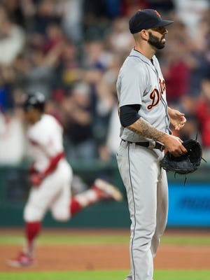 Detroit Tigers starting pitcher Mike Fiers (50) stands on the mound as Cleveland Indians shortstop Francisco Lindor (12) rounds the bases after hitting a home run during the third inning against the Detroit Tigers at Progressive Field on June 22, 2018.