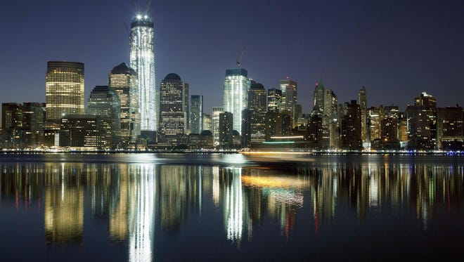 One World Trade Center towers above the Lower Manhattan skyline and Hudson River in New York.
