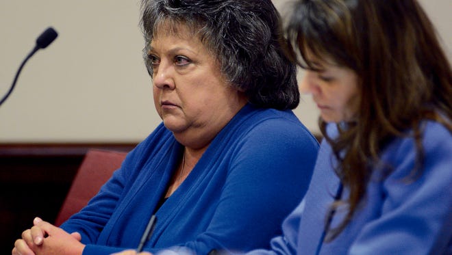 Former New Mexico Secretary of State Dianna Duran, left, sits with her attorney, Erlinda Johnson, on Friday in Santa Fe District Court.