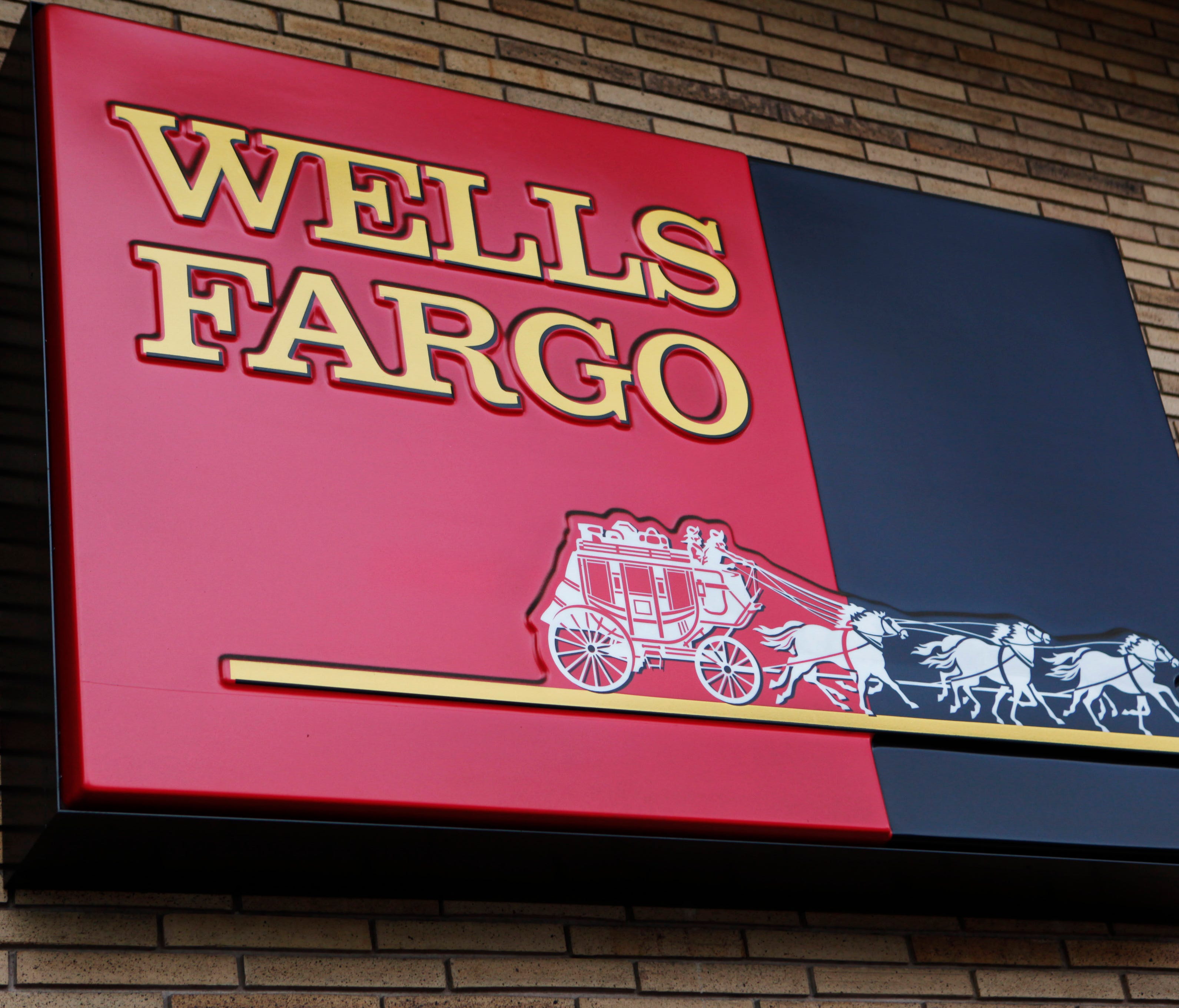File photo taken in 2010 shows a Wells Fargo sign outside a bank branch in  Palo Alto, Calif.