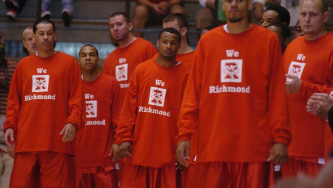 The Richmond High School alumni red team is introduced before the Alumni game in the Tiernan Center, Saturday, Aug. 23, 2008.