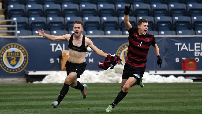 Dec 10, 2017; Philadelphia, PA, USA; Stanford Cardinal midfielder Sam Werner (left) celebrates with defender Tanner Beason (3) after scoring the game winning goal in the second overtime to defeat Indiana Hoosiers to win the 2017 NCAA National Championship at Talen Energy Stadium. Mandatory Credit: James Lang-USA TODAY Sports