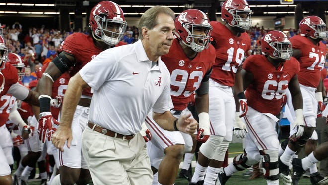 Nick Saban leads the Alabama team onto the field for the SEC Championship in Dec. 2015.