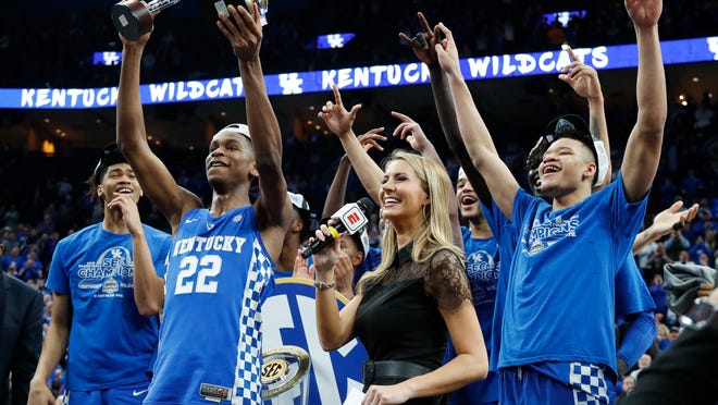 Kentucky players celebrate after beating Tennessee 77-72 in an NCAA college basketball championship game at the Southeastern Conference tournament Sunday, March 11, 2018, in St. Louis. (AP Photo/Jeff Roberson)