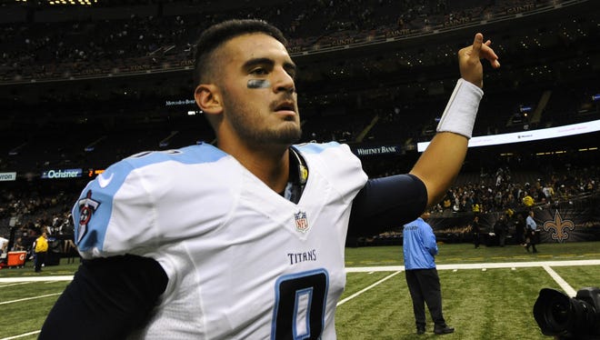 Quarterback Marcus Mariota runs off the field after the Titans defeated the Saints in overtime.