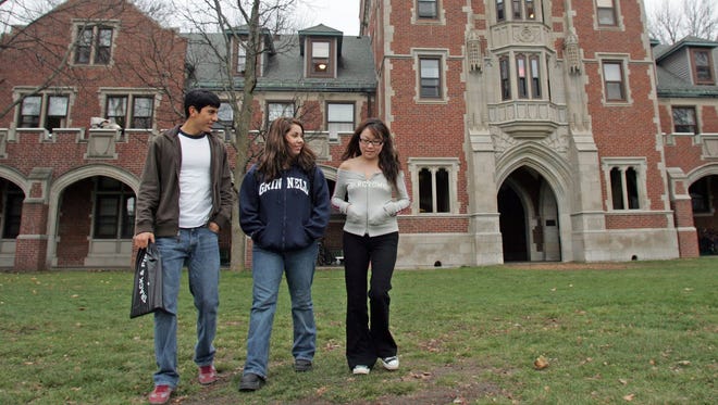 In this file photo from 2004, students walk on the campus of Grinnell College.