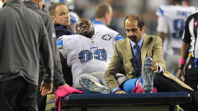 Lions defensive tackle Tyrunn Walker is taken off the field in a cart after breaking his left leg in Week 4.