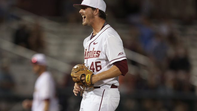 FSU’s Drew Carlton celebrates a strikeout against Auburn during the Seminoles 8-7 win in their Regional game matchup at Dick Howser on Sunday. 
