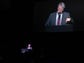 Chris Raymond, son of Tubby Raymond, speaks to a large