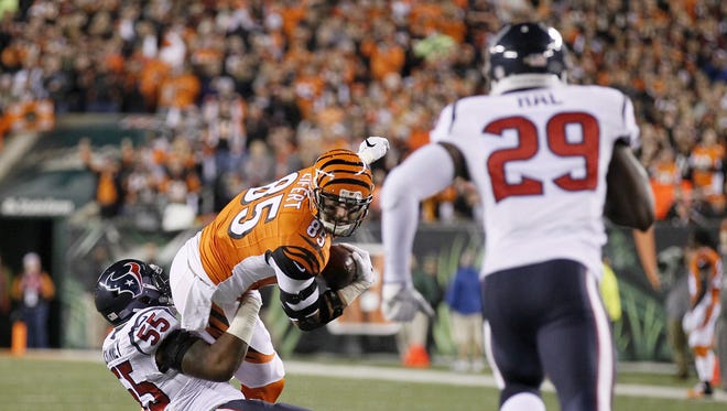 Bengals tight end Tyler Eifert is brought down on a reception in the red zone during the first quarter.