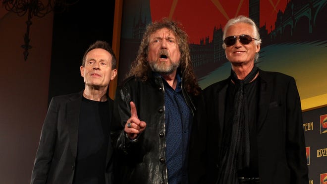 John Paul Jones, Robert Plant and Jimmy Page of Led Zeppelin attend a press conference to announce Led Zeppelin's new live DVD Celebration day at 8 Northumberland Avenue on September 21, 2012 in London, England.
