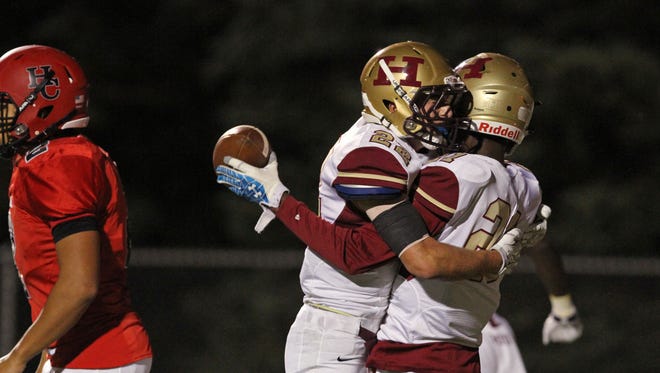 Hillsborough's Tyler Boatwright (right) and Ryan Melillo celebrate a touchdown on Sept. 27, 2015.
