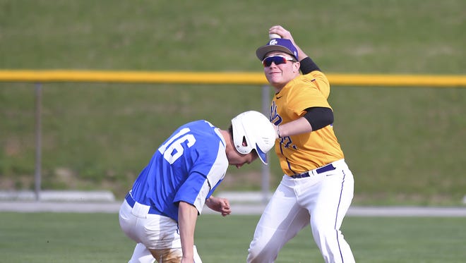 Brady Brooks (right) turns the double play against Highlands at Campbell County High School, April 26, 2018