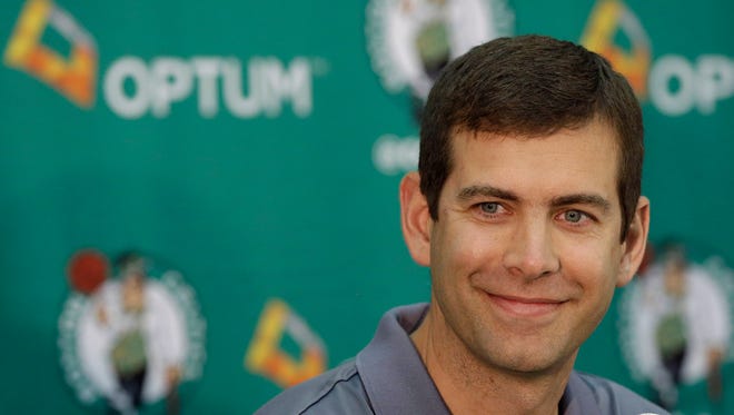 Boston Celtics head coach Brad Stevens smiles during a news conference at the Celtics basketball training facility, June 30, 2015, in Waltham, Mass.
