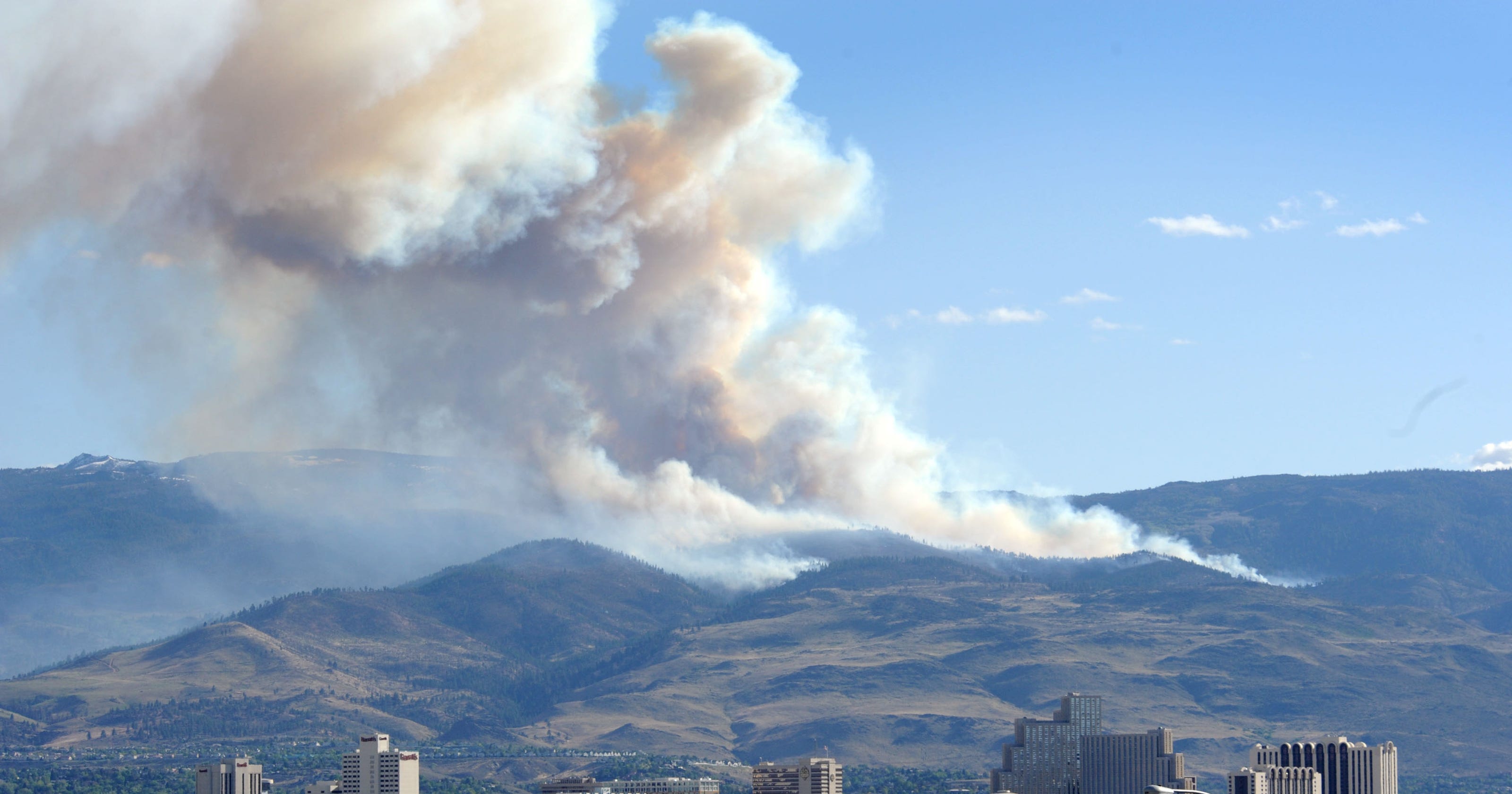 Helicopter ferries crews to remote scene of Renoarea wildfire