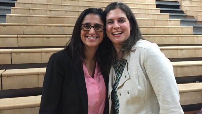 Dr. Mona Hanna-Attisha stands with her best friend, Elin Ann Warn Betanzo, after the Rachel Maddow town hall in Flint on Jan. 20, 2016. Betanzo, a water engineer, prodded her friend to study children's lead levels.