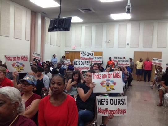 Supporters of Superintendent Dorsey Hopson hold signs