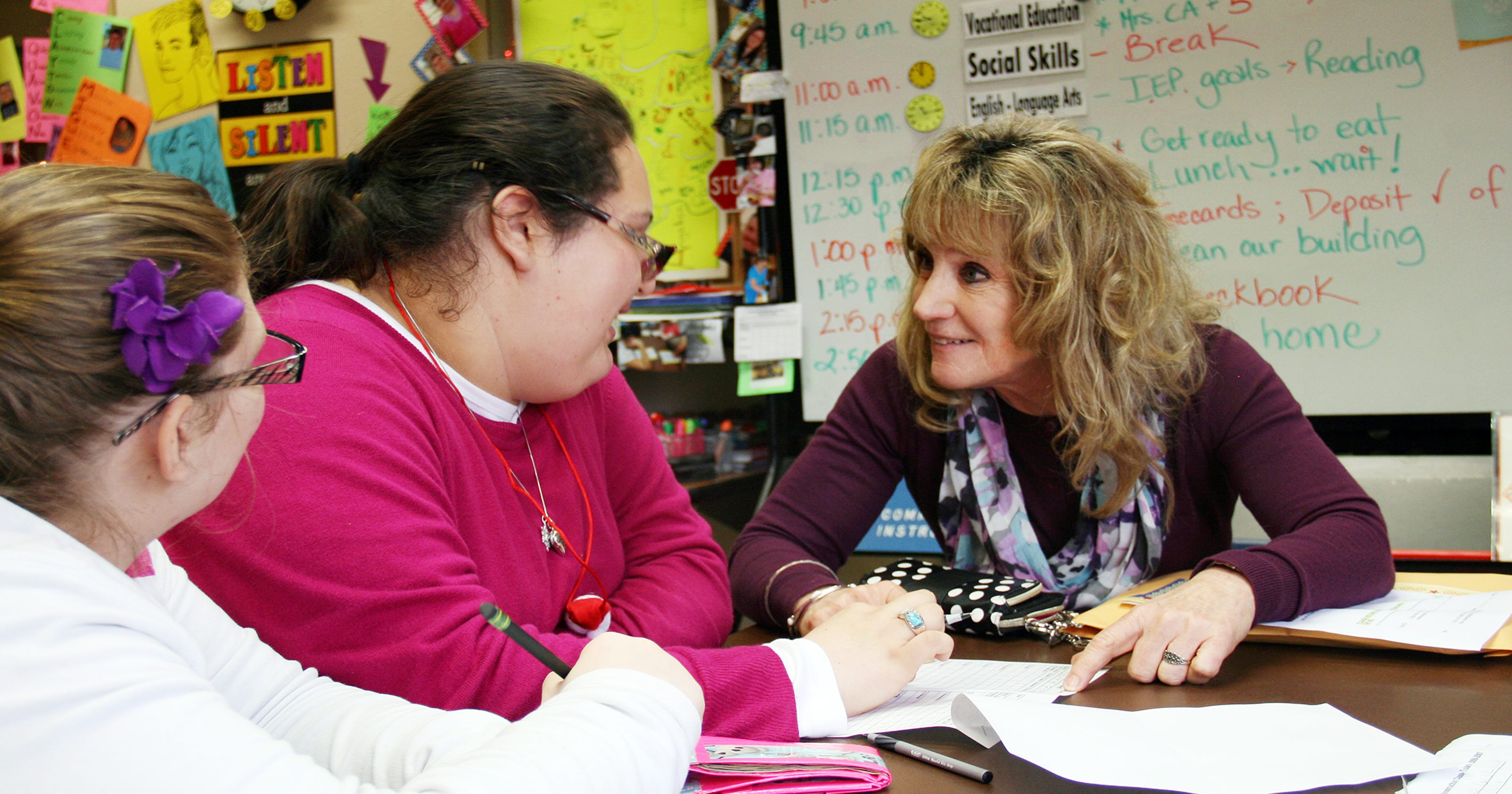Special education teacher helps students be independent