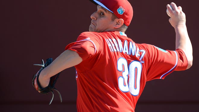 Phillies pitcher David Hernandez pitches during the workout at Bright House Field. Hernandez has been sidelined with triceps tendinitis but threw in a minor league game Tuesday for his first outing since March 1.