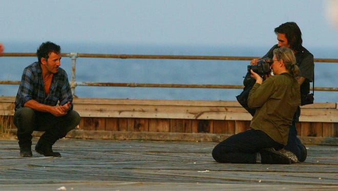 Bruce Springsteen 
on the boardwalk of Asbury Park in 2002, having his picture taken by a photo crew. He was just north of the 
carousel building.
FILE PHOTO
-

-
Text: (PPAGE1) Asbury Park 8/2/2002 Bruce Springsteen on the boardwalk of Asbury Park having his photo taken by a photo crew. He was just north of the carousel building. Michael J. Treola Staff Photographer..........MJT