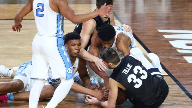 Gonzaga and North Carolina players fight for a loose ball during the national championship game at the Final Four at University of Phoenix Stadium.