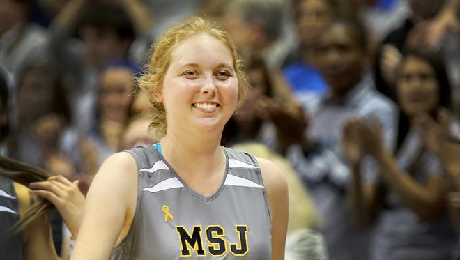 Lauren Hill is cheered by the sold-out crowd at Cintas Center on Nov. 2.