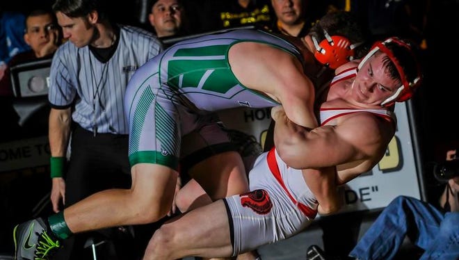 South Plainfield's Luke Niemyer (left) takes down Bishop Ahr's Andrew Brazicki during their 195- pound final match during the GMC Tournament on Saturday at Piscataway High School.