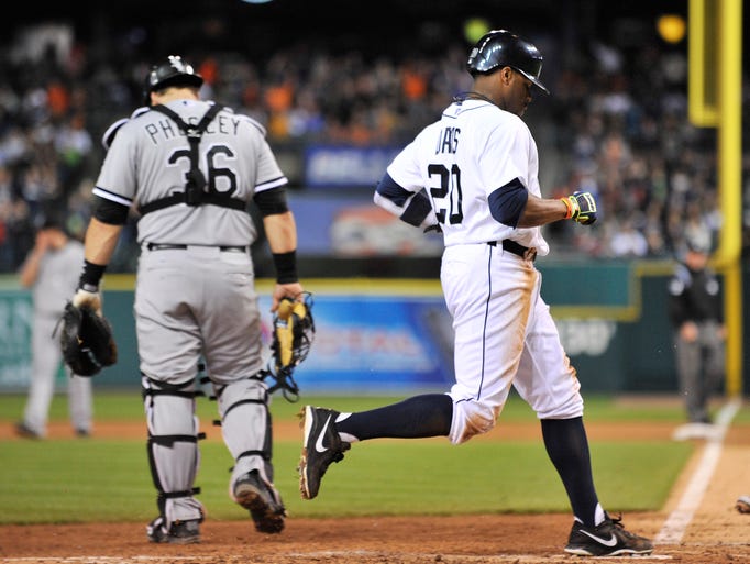 Tigers' Rajai Davis scores on a throwing error by White Sox catcher Josh Phegley after Davis stole third base in the fifth inning.