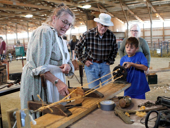 Sue Galkowski, of Genesee Depot, helps Theo Parker,