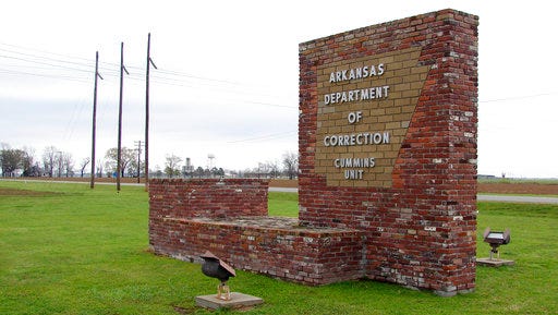 This March 25, 2017, photo shows a sign for the Department of Correction's Cummins Unit prison in Varner, Ark. Eight prisoners have been scheduled to die at the prison in April as Arkansas rushes to use an execution drug that expires at the end of the month.