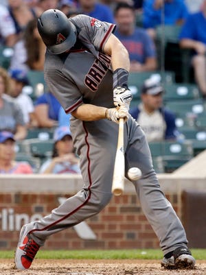Arizona Diamondbacks' Paul Goldschmidt hits a solo home run against the Chicago Cubs during the ninth inning of a baseball game Thursday, Aug. 3, 2017, in Chicago. (AP Photo/Nam Y. Huh)