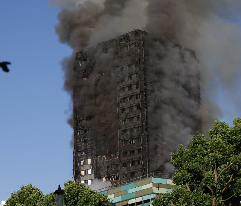 Smoke billows from Grenfell Tower as firefighters attempt to control a huge blaze on June 14, in west London.