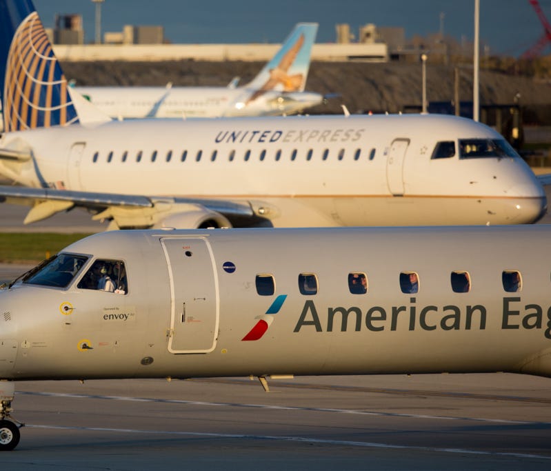 Aircraft for the regional partners of American and United taxi at Chicago O'Hare International Airport in November, 2016.