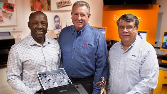 Kodak Alaris donated its services to help a local veteran in the Snapshots from the Korean War project. A video produced by Jonathan Ghent, left, won a 2015 Bronze Telly Award. Chuck Rudd (center) and Bruce A. Holroyd were key players in the project.