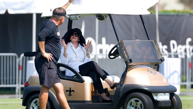 New Orleans Saints owner Gayle Benson talks to head coach Sean Payton during practice Thursday in Metairie.