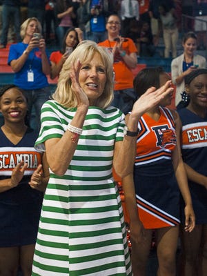 Jill Biden, the wife of vice president Joe Biden, joins the Escambia High School cheerleader in celebrating the announcement of the National Math and Science Initiative coming to Escambia County schools during a Joining Forces rally in Pensacola Friday morning April 29, 2016.