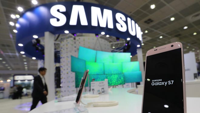 A Samsung Electronics Galaxy S7 smartphone is displayed Oct. 26 at the Korea Electronics Show in Seoul, South Korea. Samsung, one of  Corning Inc.’s largest customers, plans to shut down two major factories next year as demand weakens.