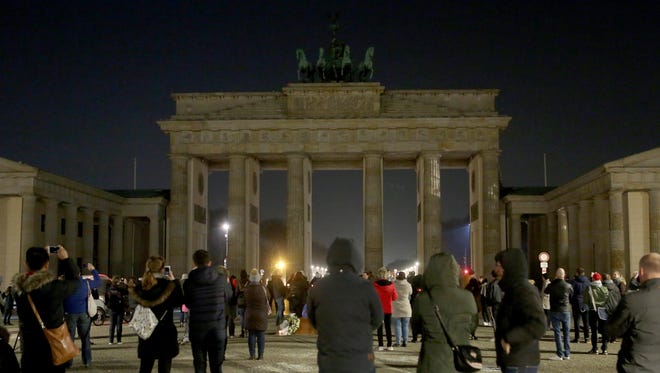 The Brandenburg Gate is seen just after being unilluminated during Earth Hour 2018 on March 24, 2018 in Berlin, Germany.