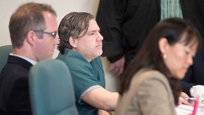 James Scarola (center) appears in Vermont Superior Court in Burlington on Oct. 15. Scarola is accused of aggravated attempted murder and first-degree aggravated domestic assault on his now ex-wife, Colleen Bray.