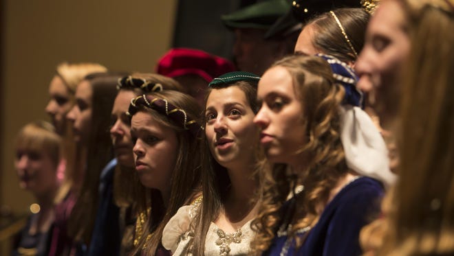The Lourdes High School Madrigal Singers perform at the Grand Opera House for a holiday sing-along event in December 2013.