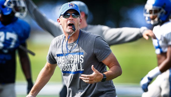 University of Memphis head coach Mike Norvell guides his team during a recent practice.