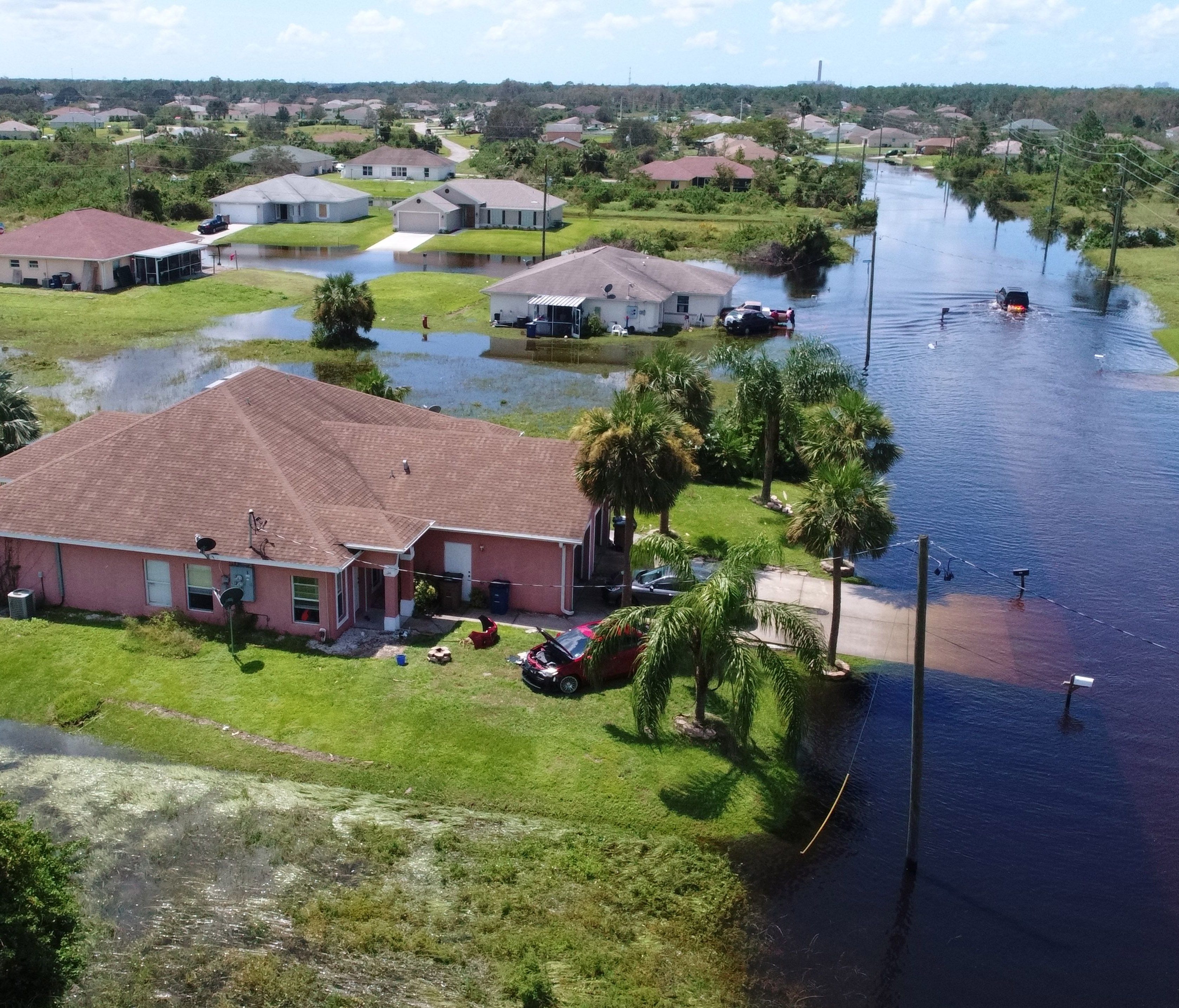 Homes are turned into islands Sept. 12, two days after hurricane Irma passed through the Lehigh Acres area outside Fort Myers, Fla.